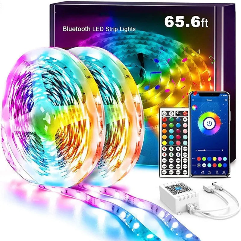 Roll of 5050 RGB LED strip light with a 44-key remote control and power adapter on a white background.