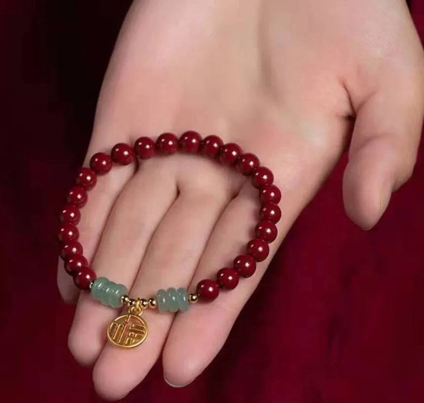 Wave-shaped bracelet with cinnabar segments and copper beads in national style design