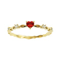 Gold or silver personalised zircon peach heart ring showing five available sizes on a ring sizer.