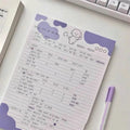 B5 sticky note pad with dog illustration cover, showing one sheet peeled back to reveal adhesive.