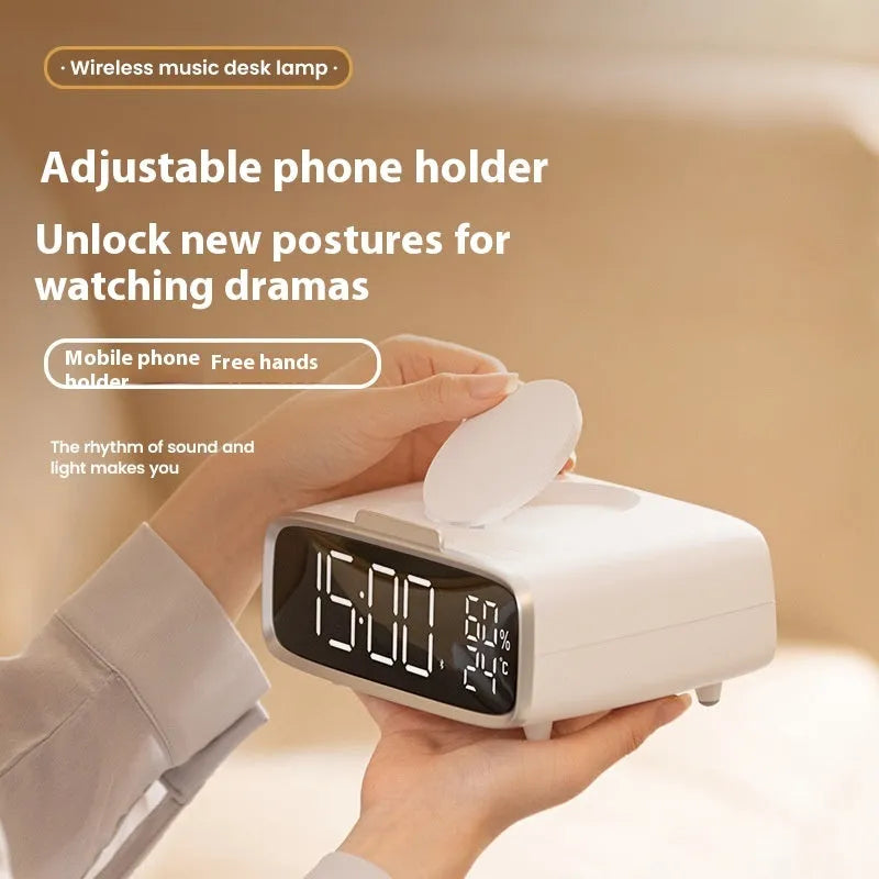 White wireless charging Bluetooth speaker with night light function on bedside table