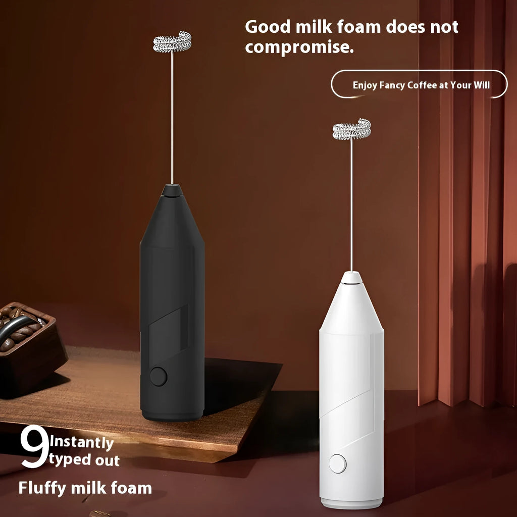 A handheld electric milk frother with a stainless steel wand and a plastic body, shown in black, white, and khaki colour options.