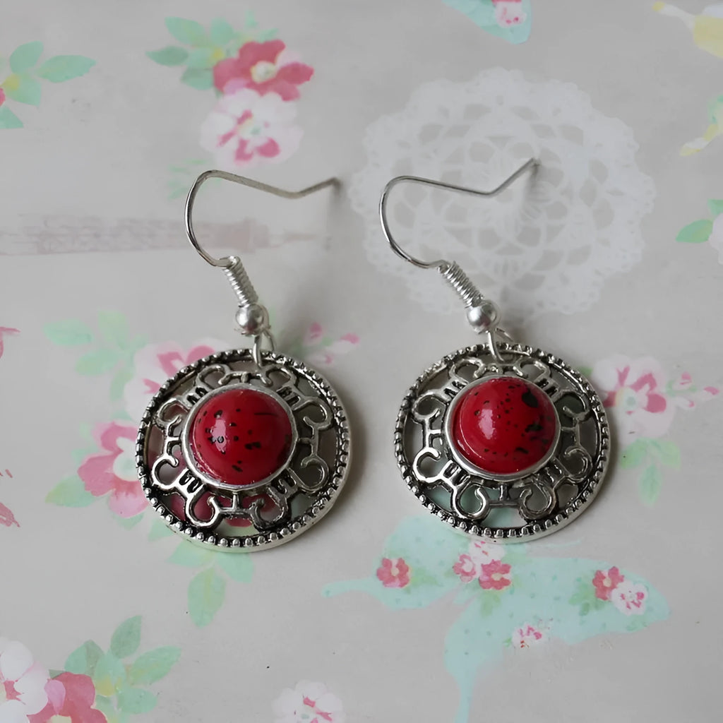 Handmade Miao ethnic silver earrings with turquoise geometric flower disc design