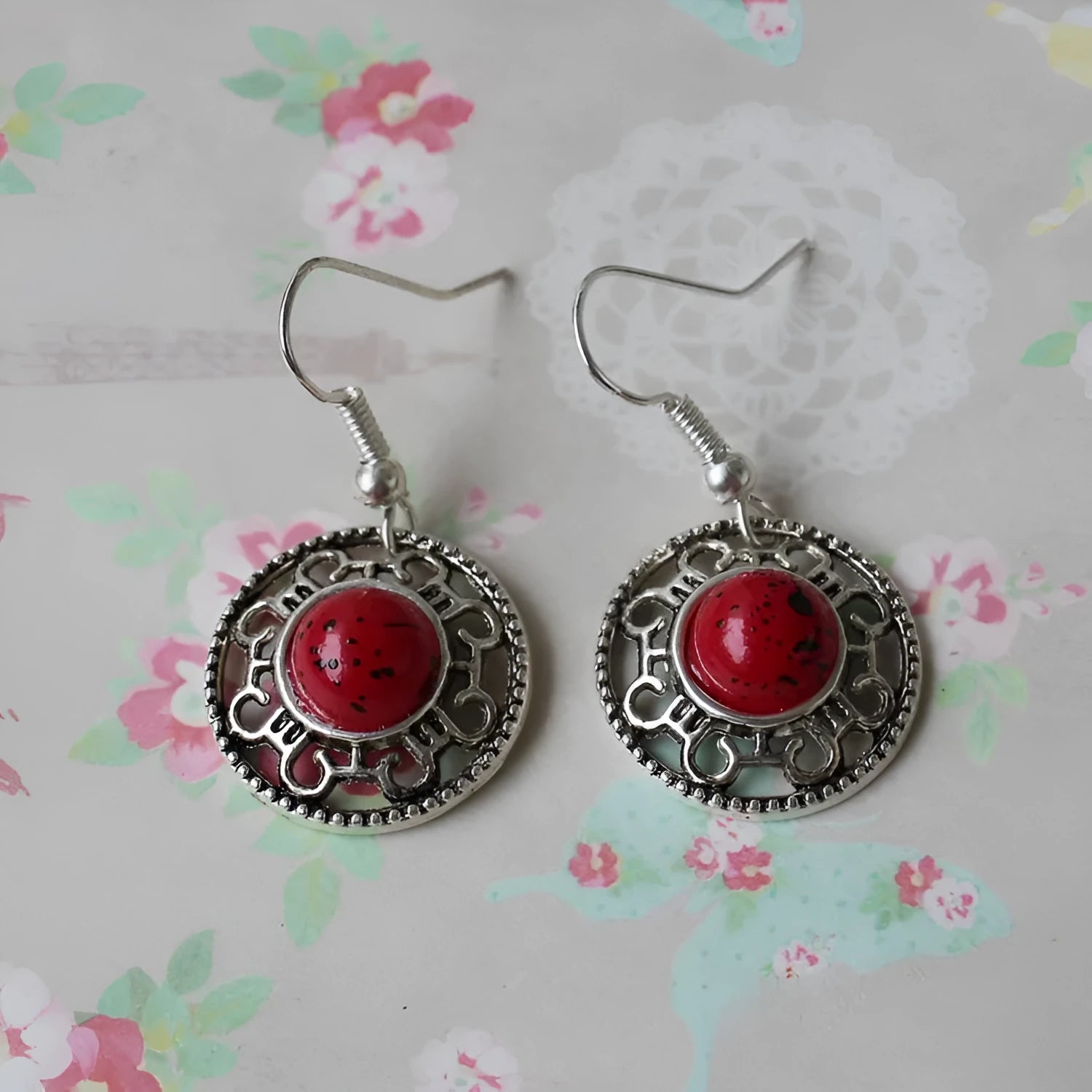 Handmade Miao ethnic silver earrings with turquoise geometric flower disc design