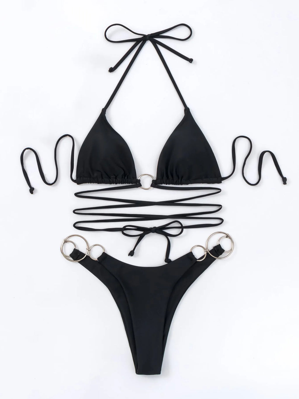 Black women's bikini set with metal ring detail and long criss-cross straps on a solid colour background.