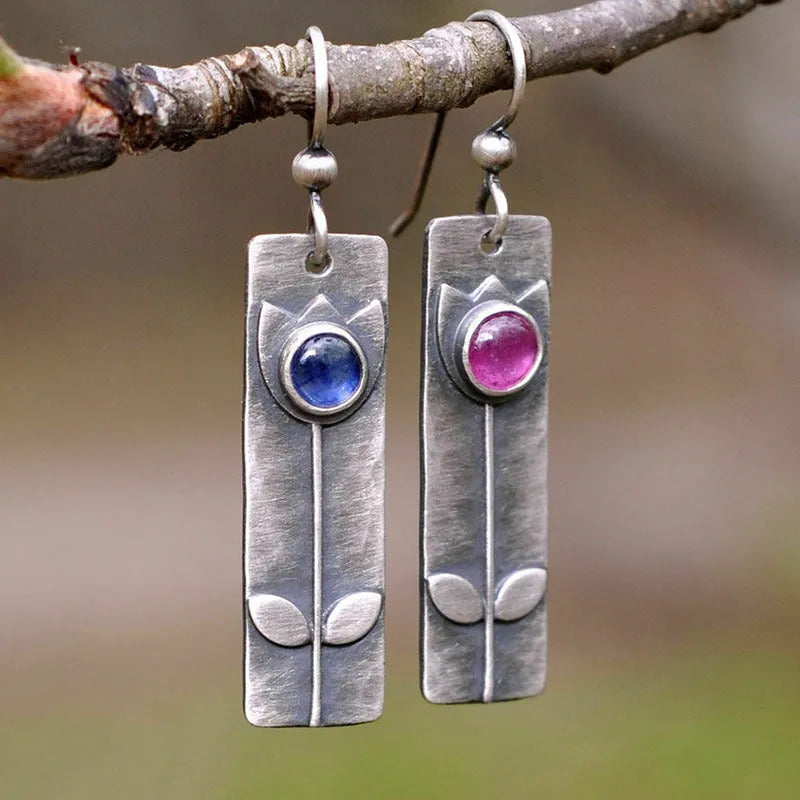 Antique finish red sapphire earrings with geometric ellipse design on electroplated metal