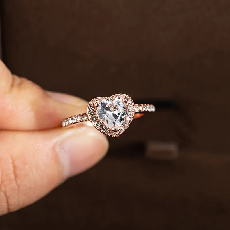 Heart-shaped crystal wedding ring with electroplated rose gold finish on white copper band