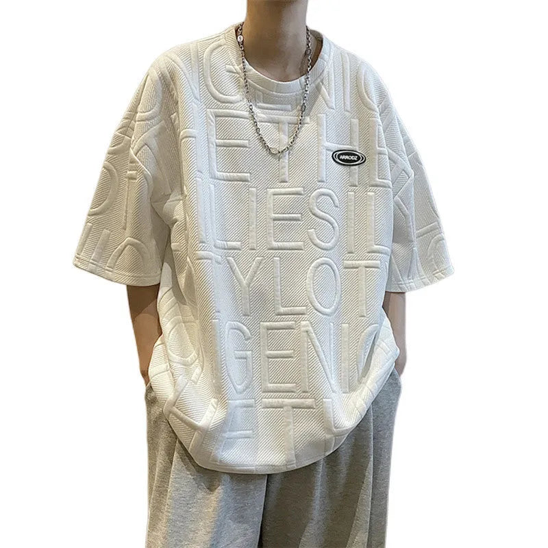 A grey men's loose-fit T-shirt with a retro style and raised 3D letter print on the chest.