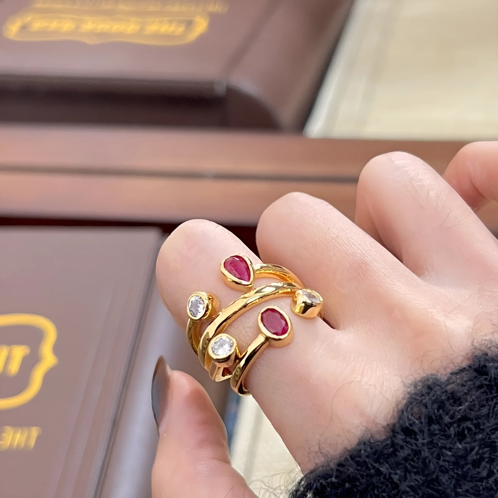 Geometric copper ring with irregular cross design and diamond accents in two-tone colours