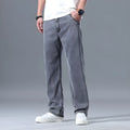 Men's loose fitting straight-leg jeans in lyocell fabric, shown in a light blue colour