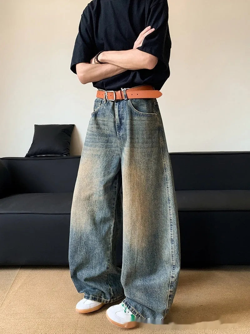 Men's retro blue distressed wide-leg denim trousers with machete styling detail