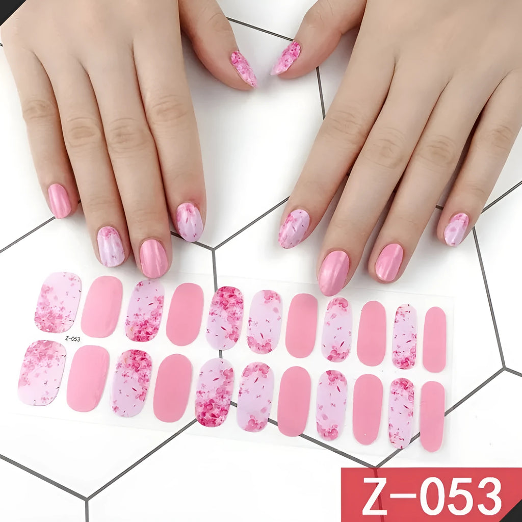 Korean nail stickers pack showing cartoon, strawberry and floral designs with included nail file
