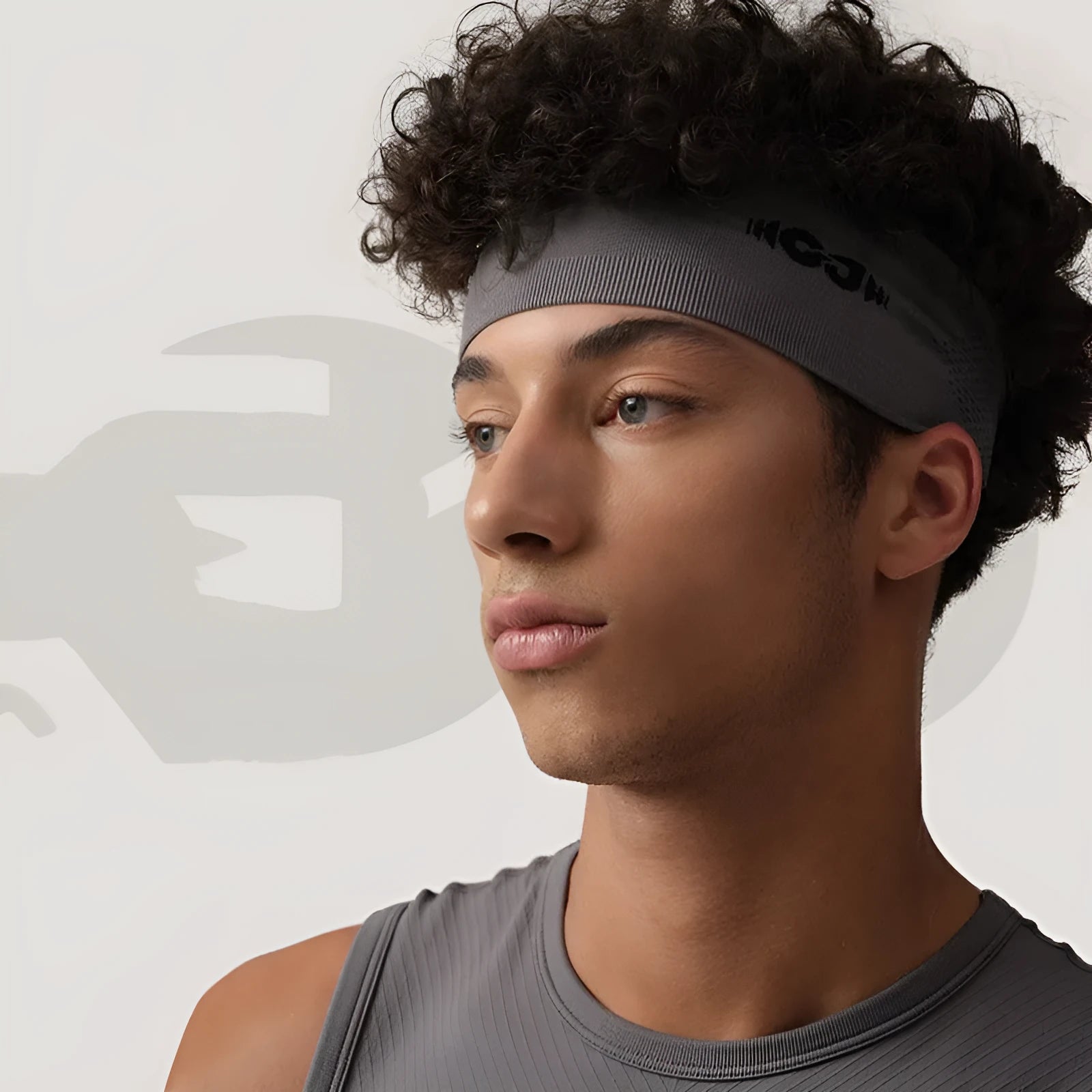 Seamless knitted sports hair band in black, grey, and blue for men and women during exercise.