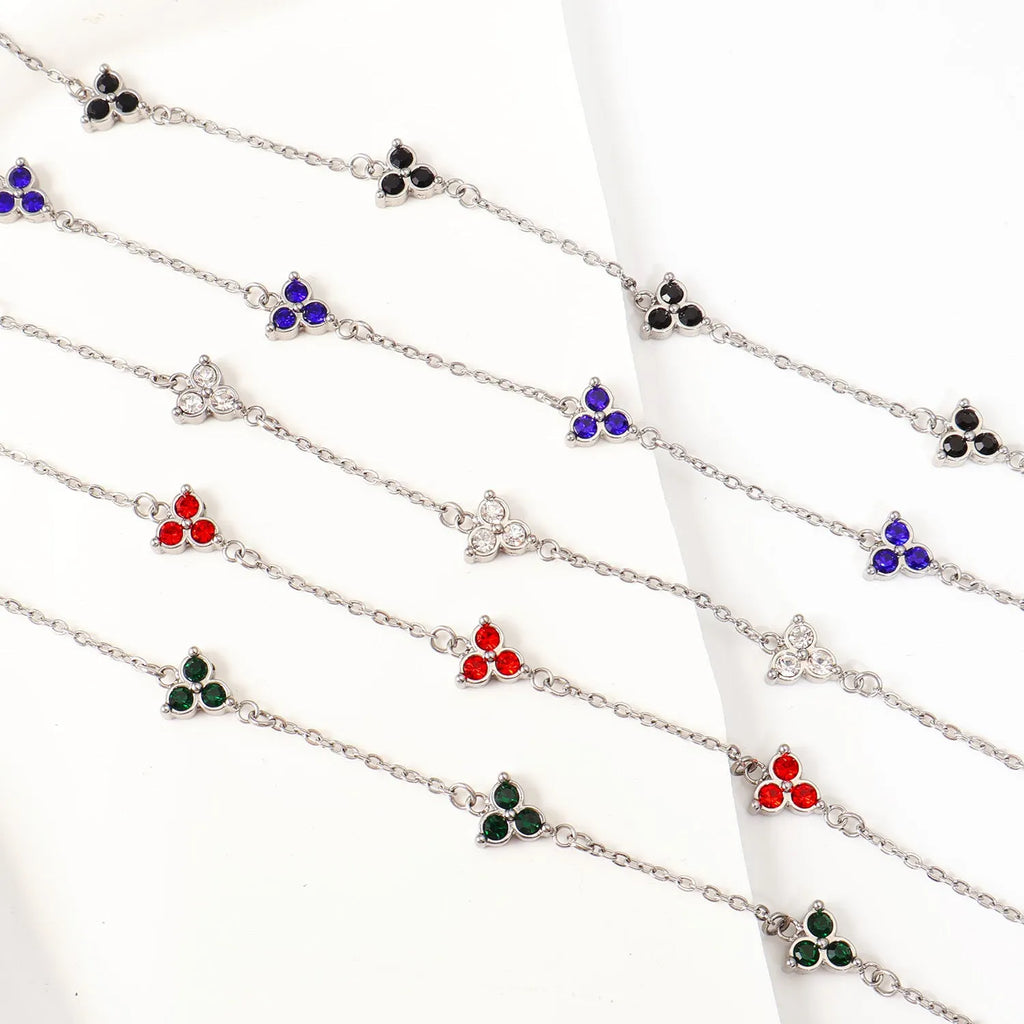 Stainless steel women's bracelet with three diamond geometric design and gemstone settings