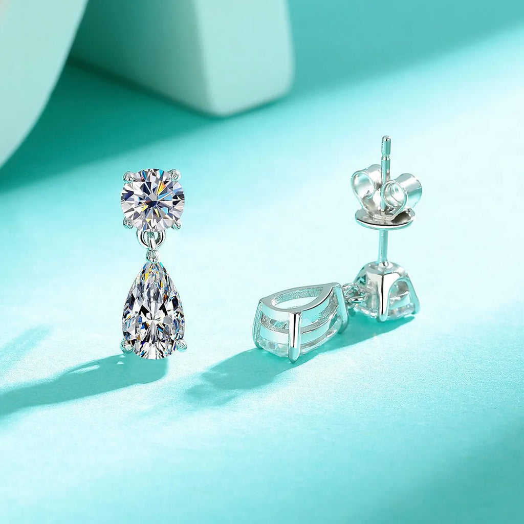Sterling silver water drop moissanite stud earrings with round and elongated stones in gold and silver plating options