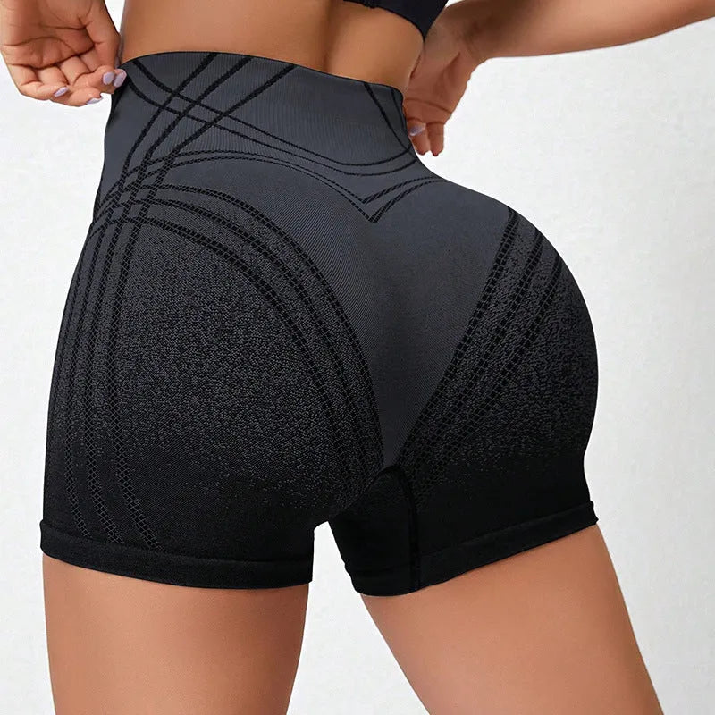 Women's high waisted gradient fitness shorts in black, shown for yoga and running.