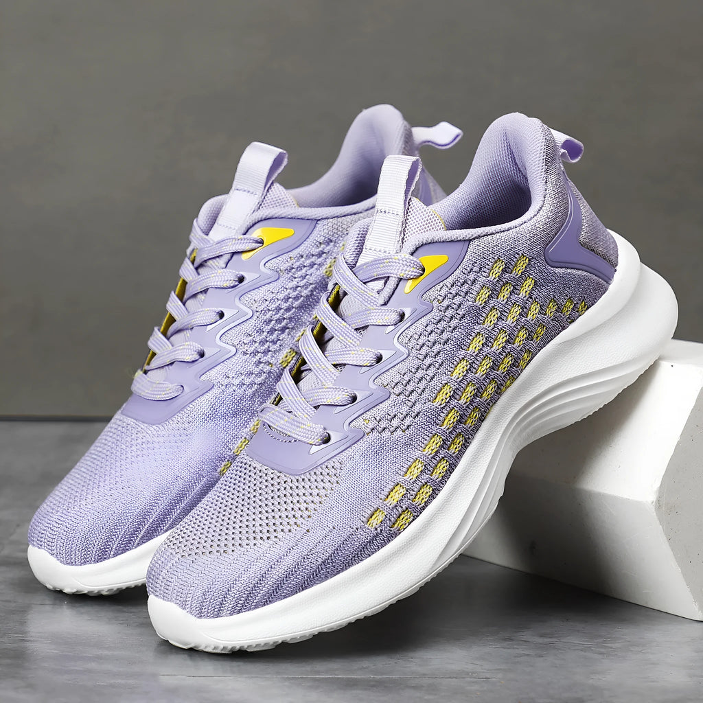 Women's lavender purple Flyknit running shoes with mesh lining and EVA sole on a white background.