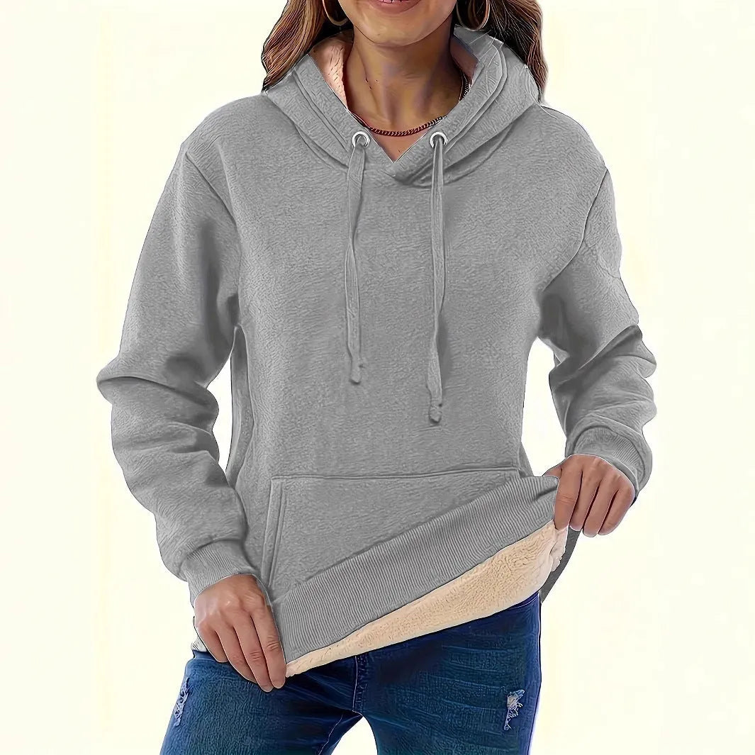 Women's loose fit hooded sweater in thick grey polyester fleece with a 3D pattern and front pockets.