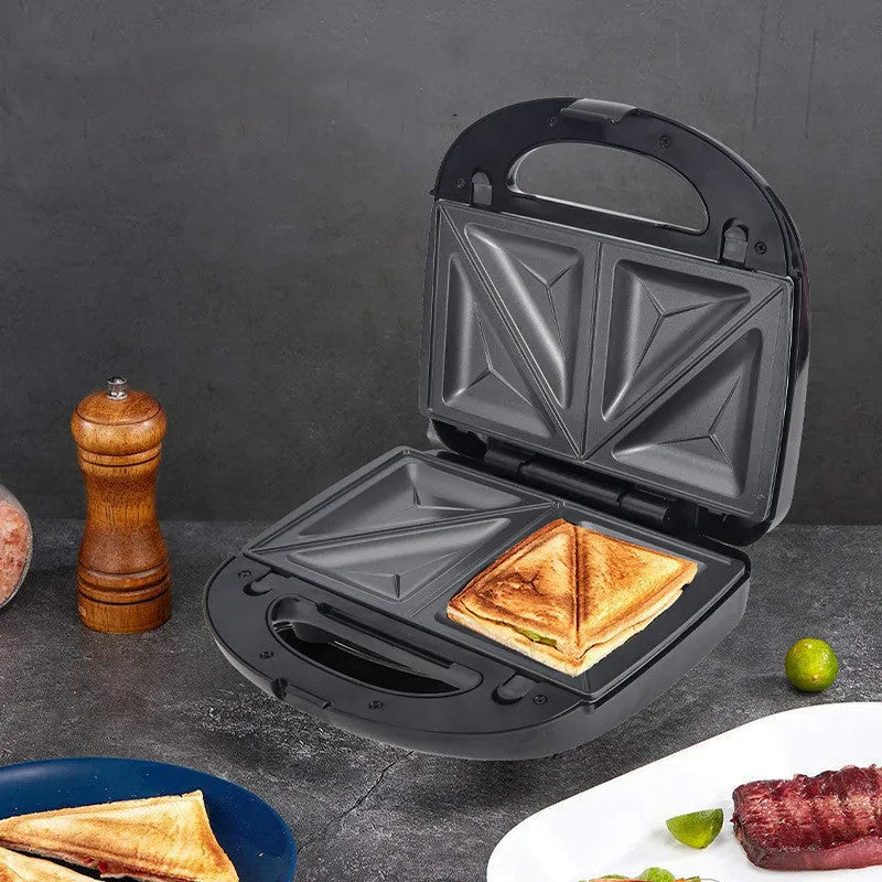 Black electric sandwich pan with double-sided heating, brushed stainless steel lid, and six non-stick cooking plates.