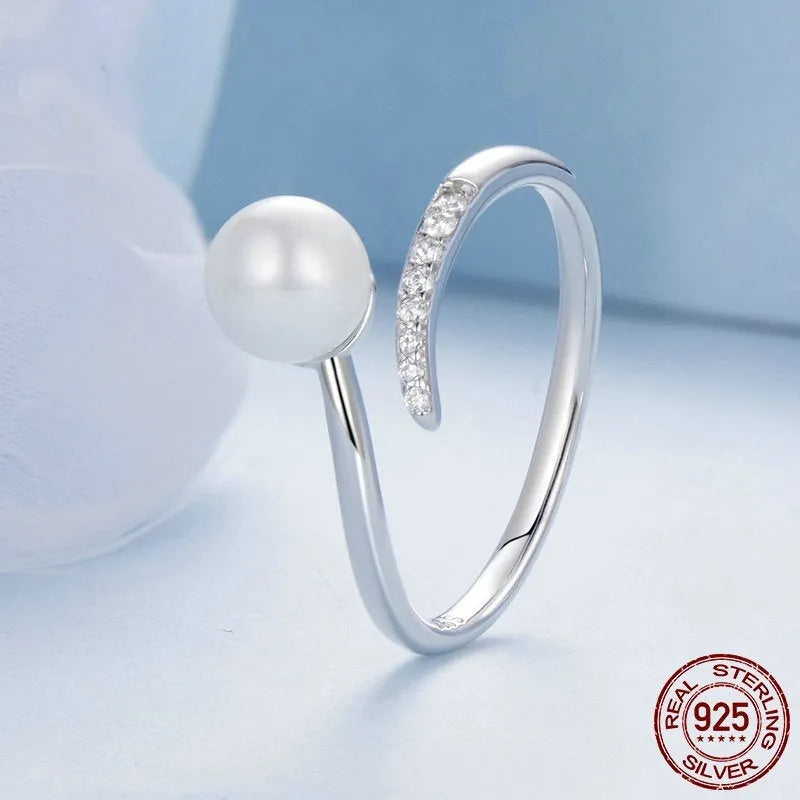 Adjustable S925 sterling silver ring with shell pearls in open loop design