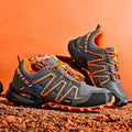 Men's gray orange plus size casual shoes with low-top design and rubber sole.