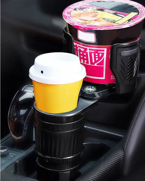 Retractable black car drink holder with adjustable base on a car dashboard.