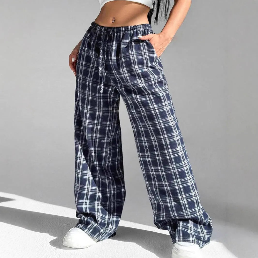 Women's red plaid casual trousers with drawstring waist and patch pockets laid flat