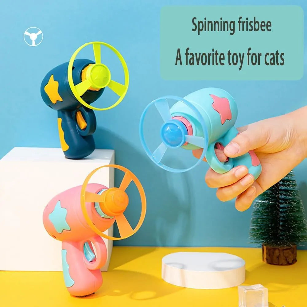Blue plastic cat toy gun with spinning Frisbee launcher for indoor cat play