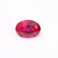 Loose cultivated ruby gemstone in pigeon blood red colour on a white background, shown in different cuts.