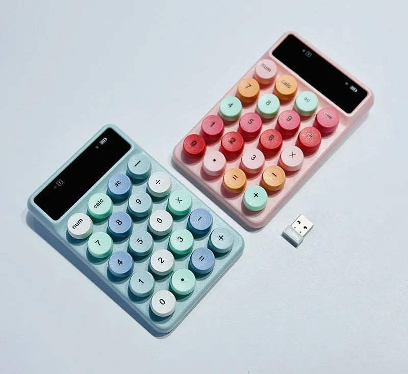 Q3 wireless digital keyboard in a macaron colour option on a desk.