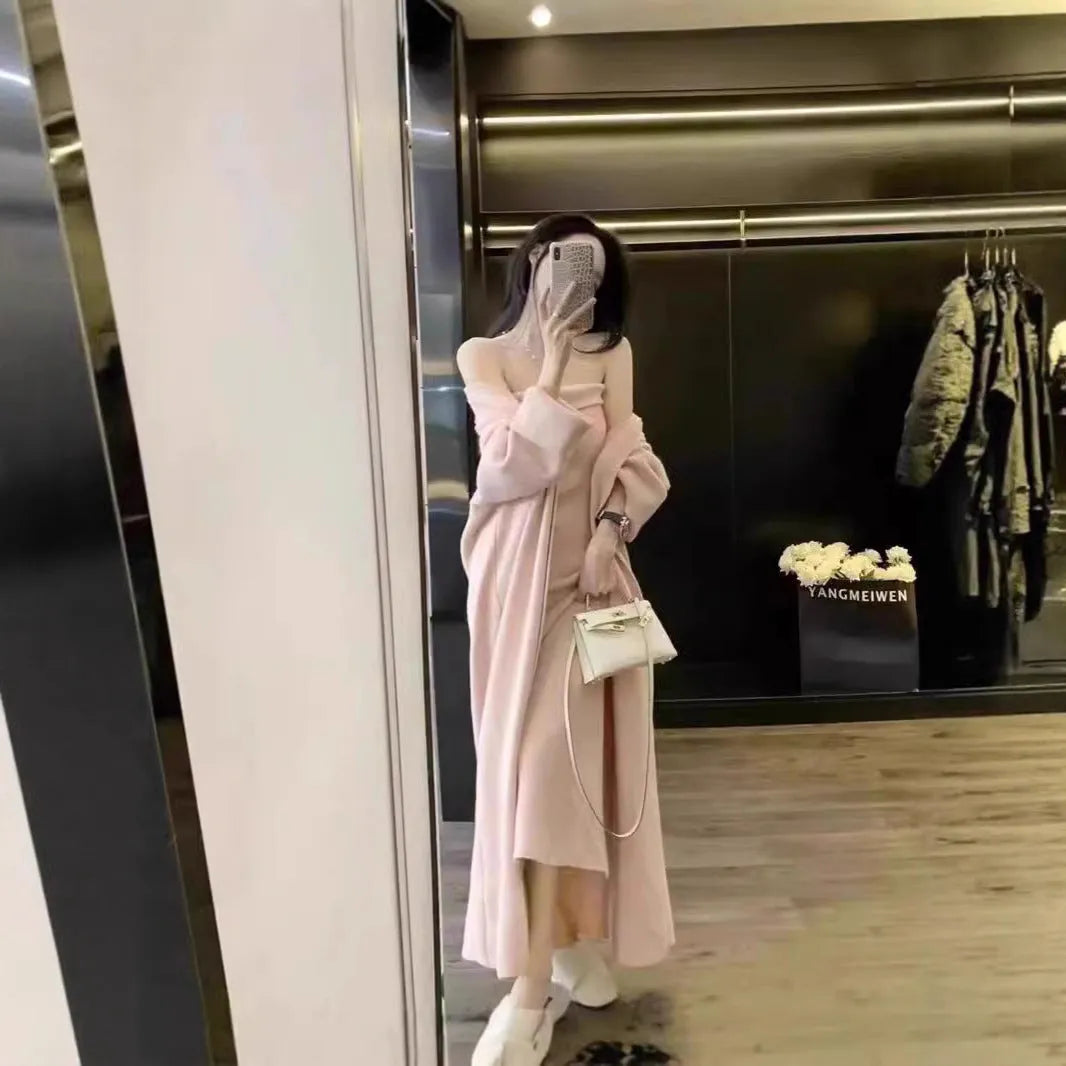 Women's grey knitted cardigan dress and coat suit set with long skirt and flocking detail.