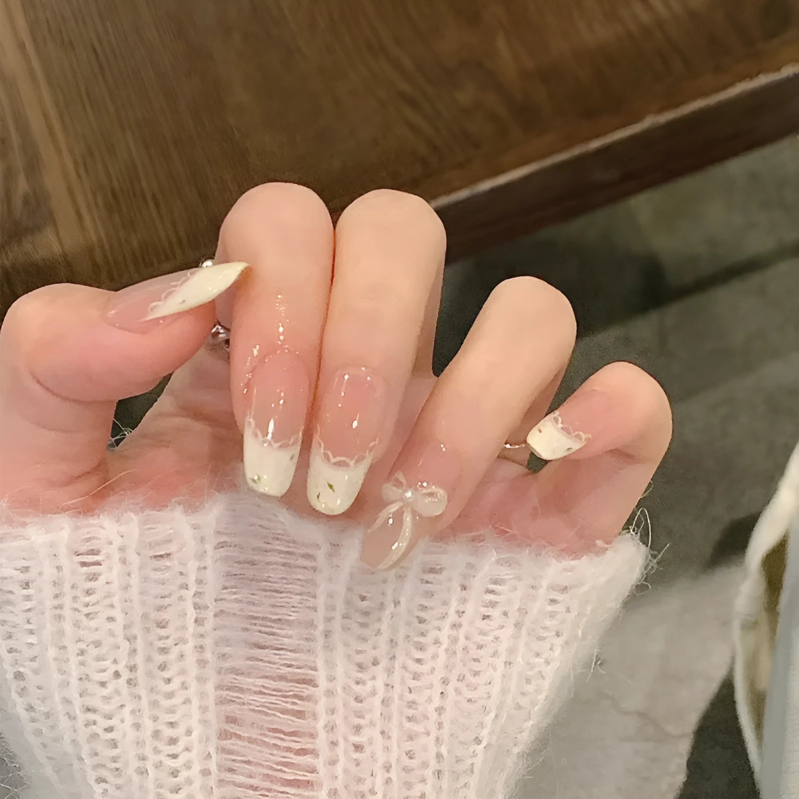 Set of sweet girl themed press-on false nails in assorted random colours and designs.