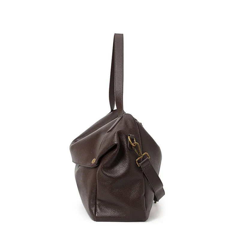 Brown genuine leather women's shoulder bag with a horizontal square shape and shoulder strap.