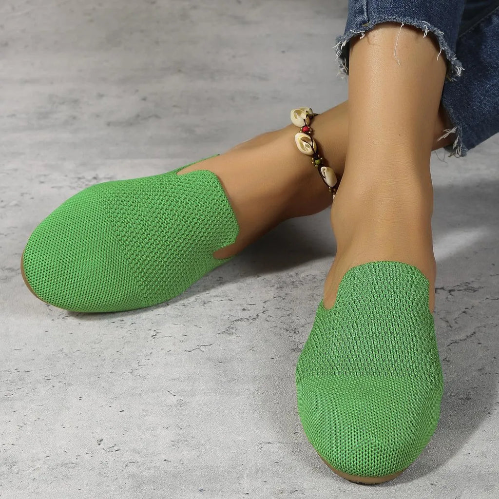 Women's apricot mesh slip-on sandals with round toe and flat rubber sole on a plain background.