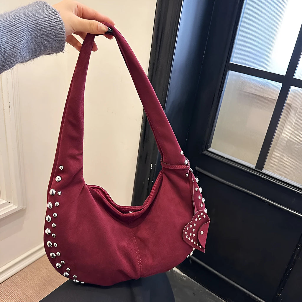 Soft plush retro style women's handbag in strapless tote design showing colour options