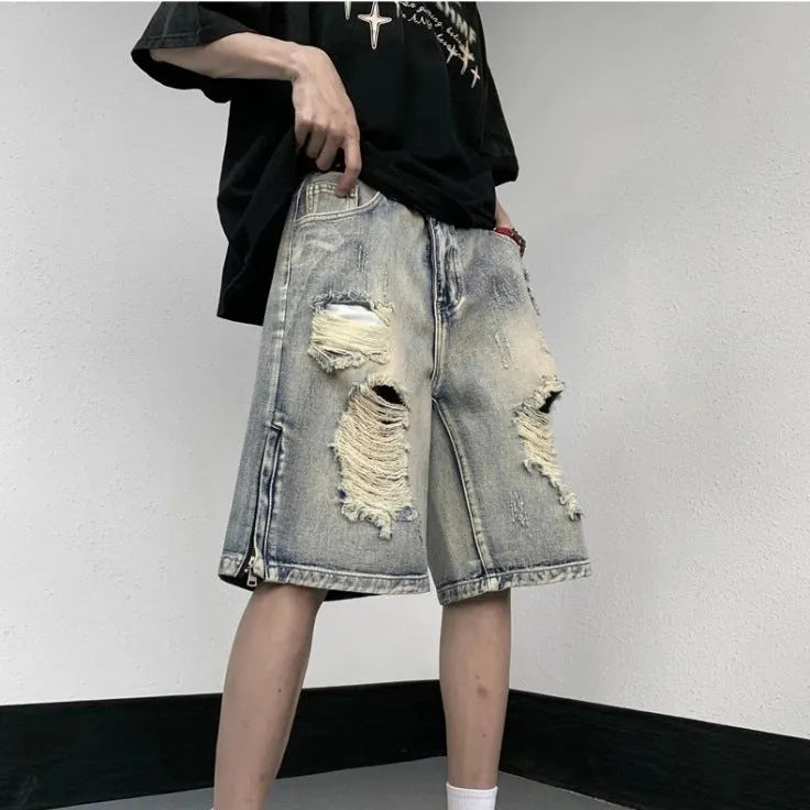 Blue retro tattered denim shorts with wide leg cut on mannequin