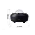 White galaxy star projector night light with Bluetooth speaker showing star projection on wall