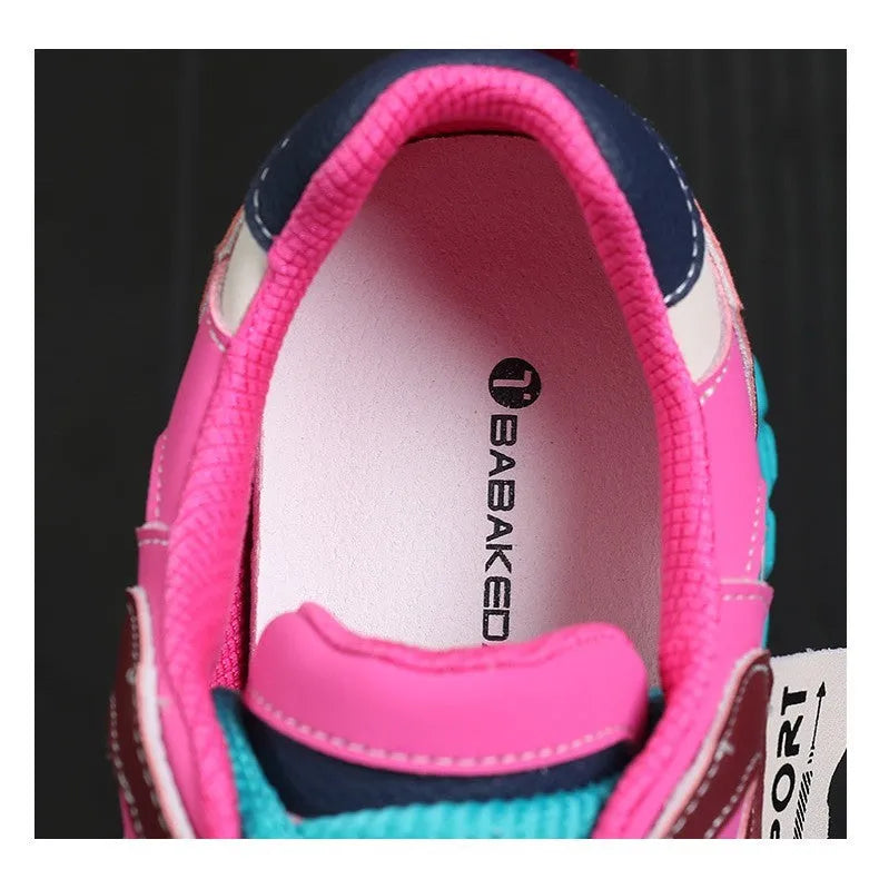 Women's leather sports casual shoes with thick sole and lace-up front in black and white colour.