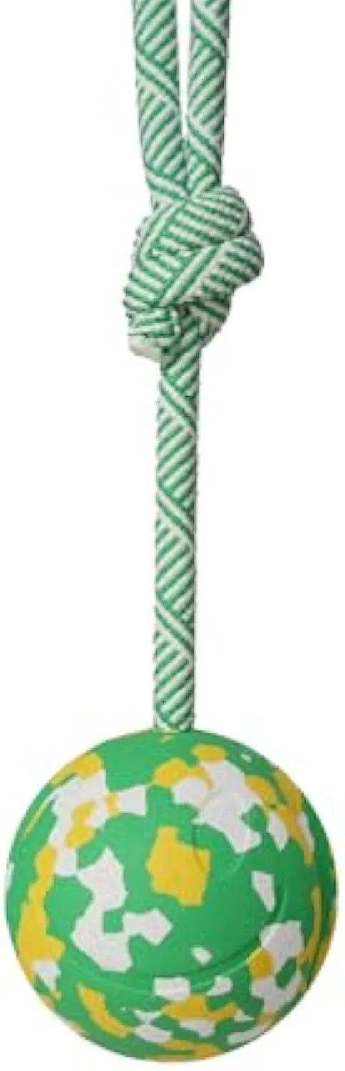 Natural rubber dog ball attached to a nylon rope for interactive fetch and tug-of-war play