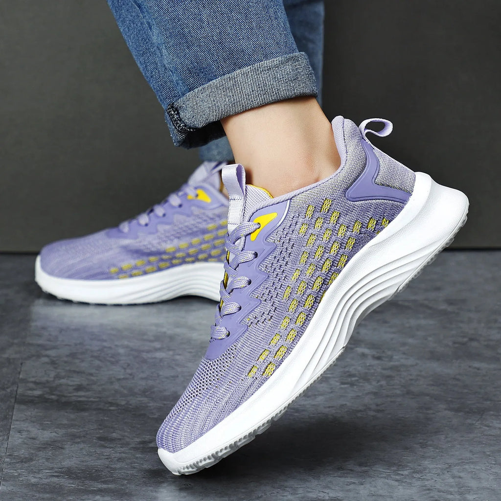 Women's lavender purple Flyknit running shoes with mesh lining and EVA sole on a white background.