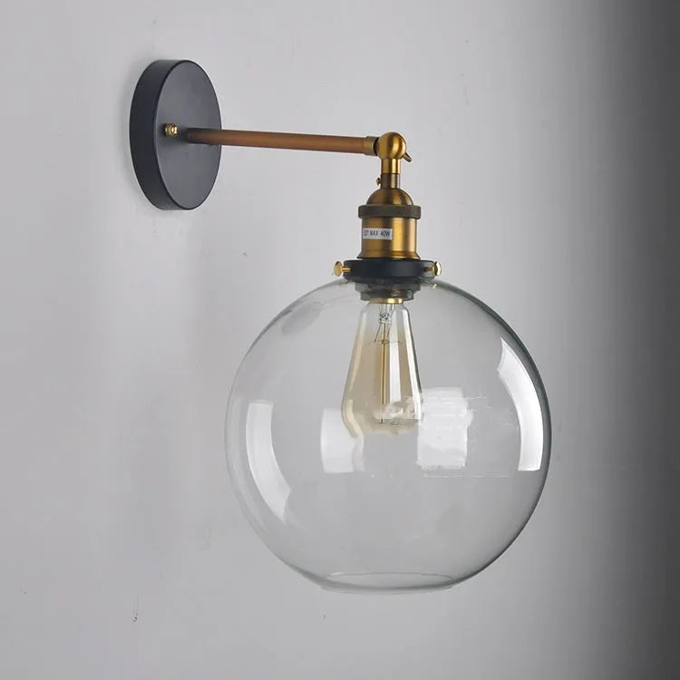 Retro round glass wall lamp with aluminium holder, shown in amber, smoky grey, and transparent finishes.