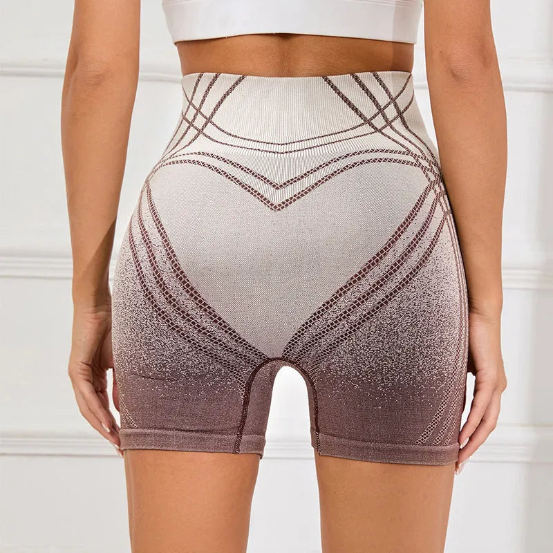 Women's high waisted gradient fitness shorts in black, shown for yoga and running.