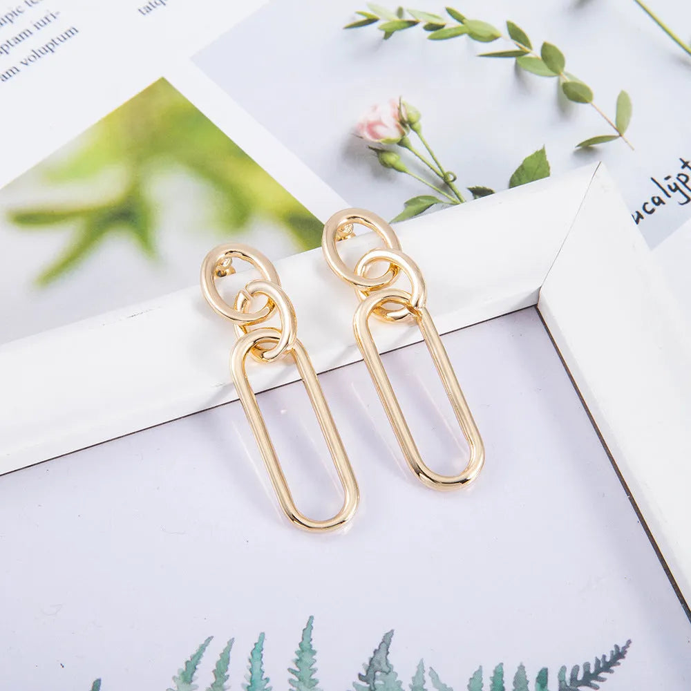 Geometric sterling silver needle colour hoop earrings with ring and line design elements