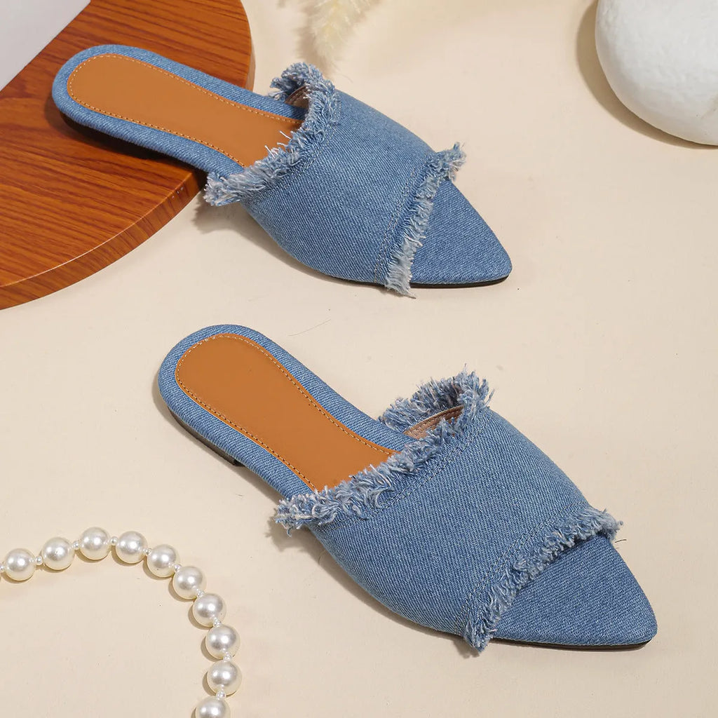 Women's denim flat slippers with a tassel detail and leather lining in a choice of colours.