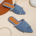 Women's denim flat slippers with a tassel detail and leather lining in a choice of colours.