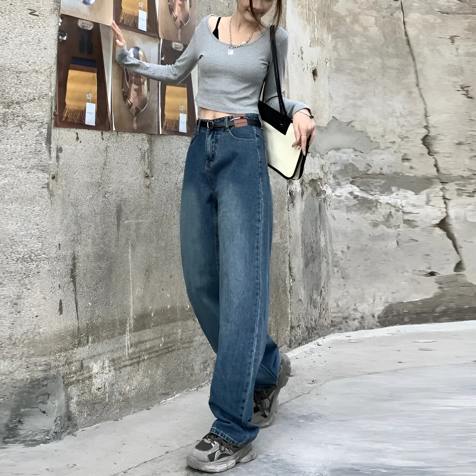 Women's retro blue high-waisted straight leg denim jeans on a neutral background.