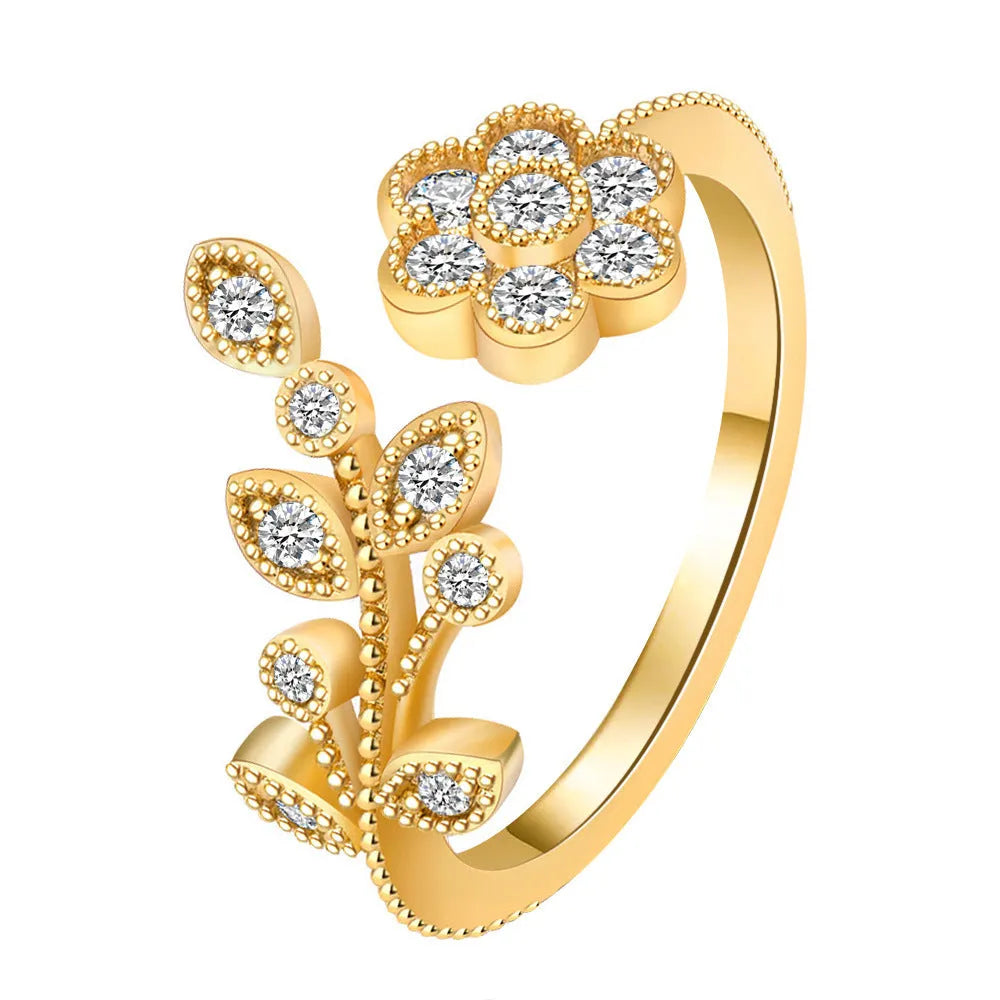 Women's open back copper ring with floral leaf design in a white diamond finish.