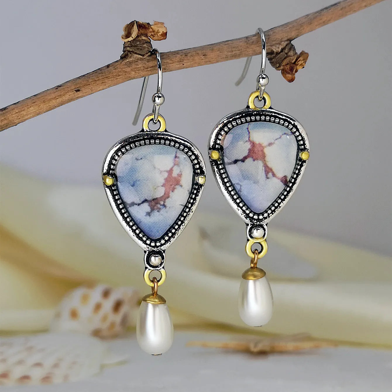 Women's lavender turquoise and white pearl drop earrings with geometric retro design.