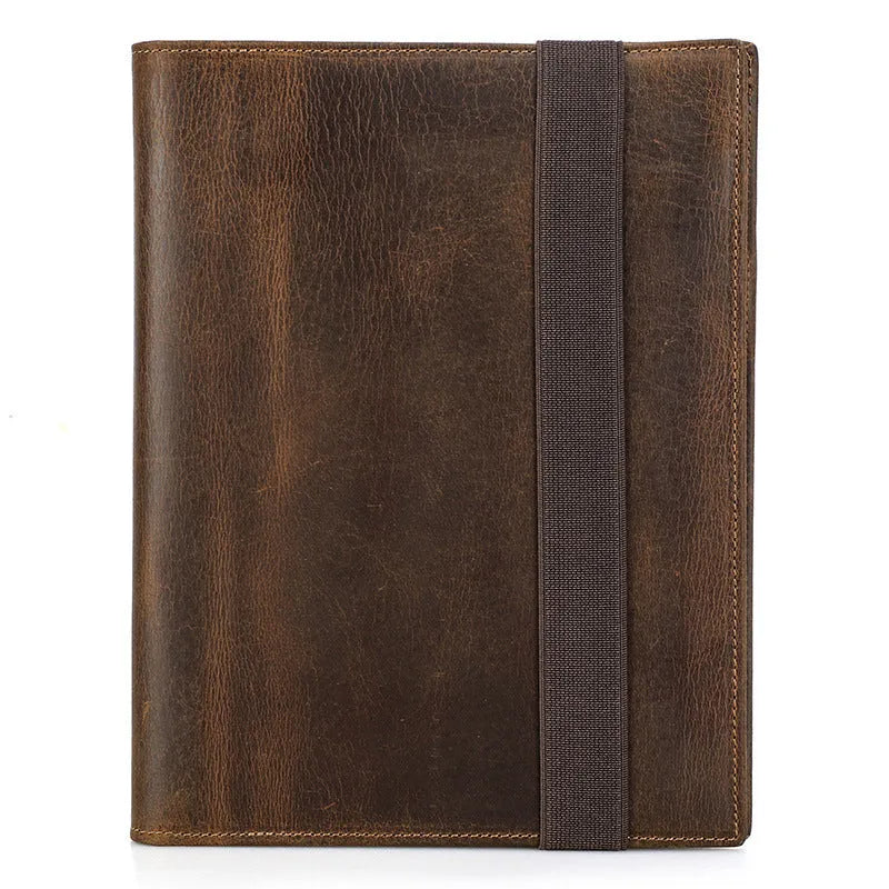 Brown Crazy Horse leather protective sleeve for A5 notebooks with a socket-type closure.