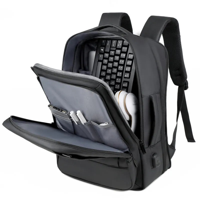 Large black waterproof backpack with curved shoulder straps showing business travel design